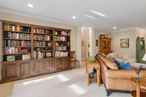 An impressive wall of built-in bookshelves creates space for a library, collections, and display.