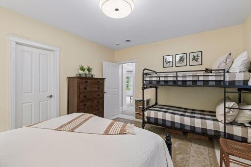 The lower-level bedroom offers flexibility for family, guests, or a hobby room.