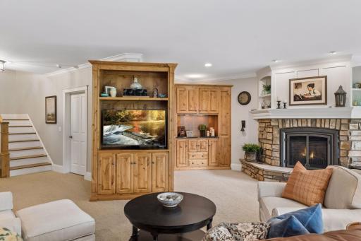 Custom cabinetry and built-ins provide exceptional storage throughout the lower level.