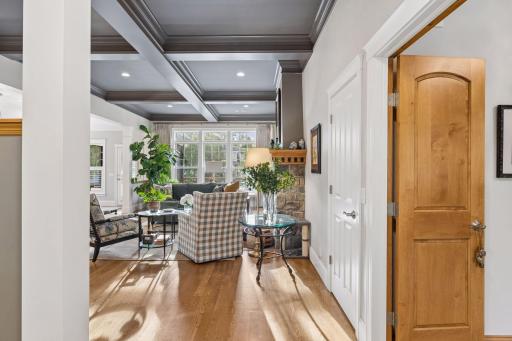 Hardwood floors and generous windows bring warmth and natural light throughout the main level.