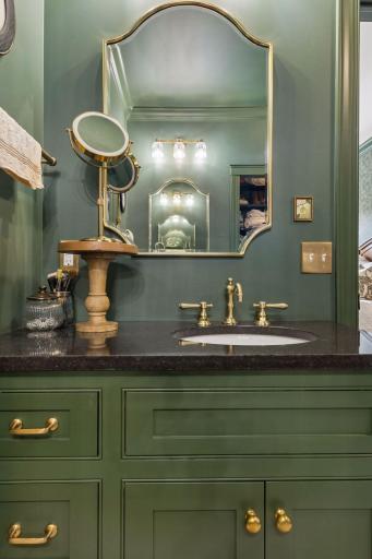 Custom vanity details bring personality and warmth to the primary bath.