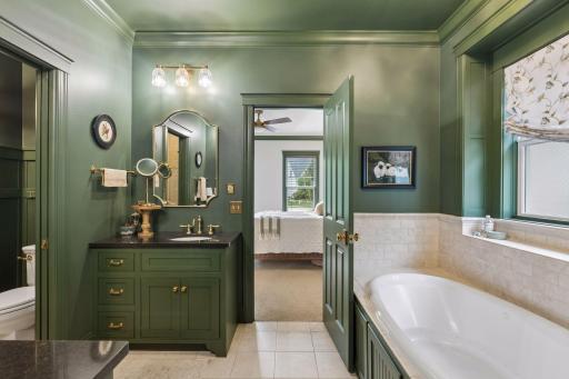 A spacious primary bath with soaking tub, natural light, and thoughtful finishes throughout.