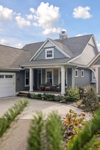 Classic Liberty on the Lake curb appeal with welcoming front porch and beautifully maintained landscaping.