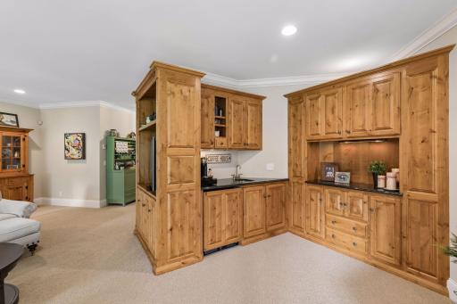 The wet bar and custom cabinetry make the lower level especially well suited for entertaining.