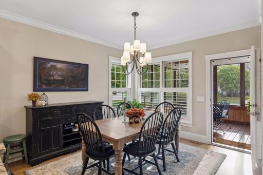 Dining space just off the kitchen with direct access to the screen porch and outdoor living areas.