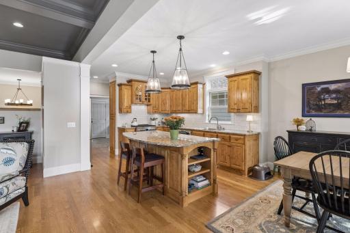 The kitchenâs knotty alder cabinetry brings warmth and craftsmanship to the heart of the home.