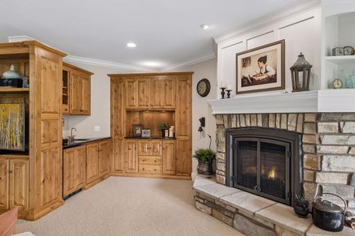 A custom wet bar adds function and personality to the lower-level entertaining space.