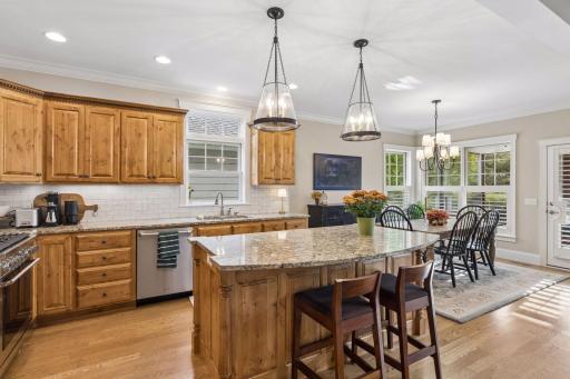 A generous center island adds prep space, seating, and a natural gathering point.