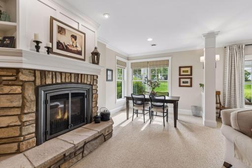A flexible lower-level sitting area with direct views toward the landscaped grounds.