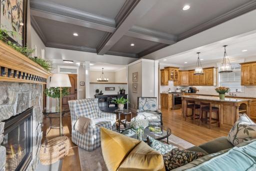 The main level flows naturally from fireside seating into the kitchen and dining areas.