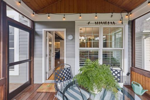Wood ceilings and screened views give the porch warmth, character, and a true connection to the landscape.