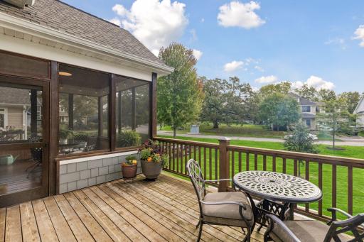 The deck connects directly to the screen porch for flexible outdoor entertaining.