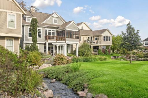 The creek winds directly through the neighborhood, creating a peaceful natural backdrop.