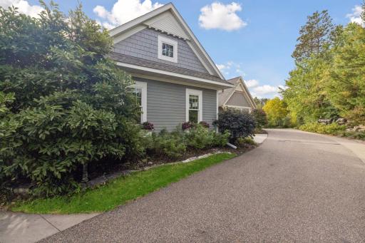 A side view of the home showing its classic lines and private setting.
