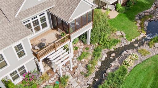 From above, the homeâs rear outdoor spaces and creekside setting really come into focus.