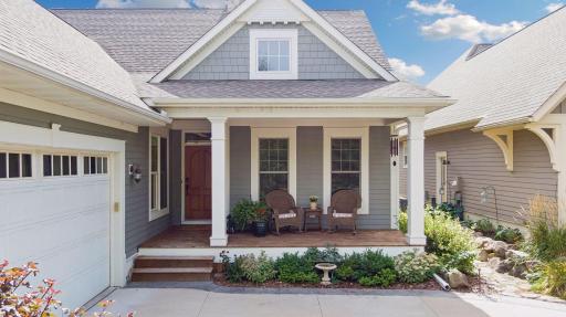 The homeâs architecture and landscaping create a warm sense of arrival from the street.