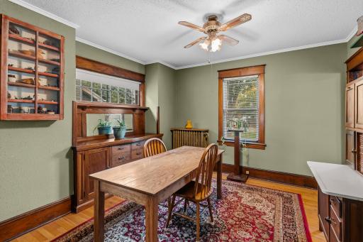 Formal dining room offers hardwood floors and a beautiful built in buffet