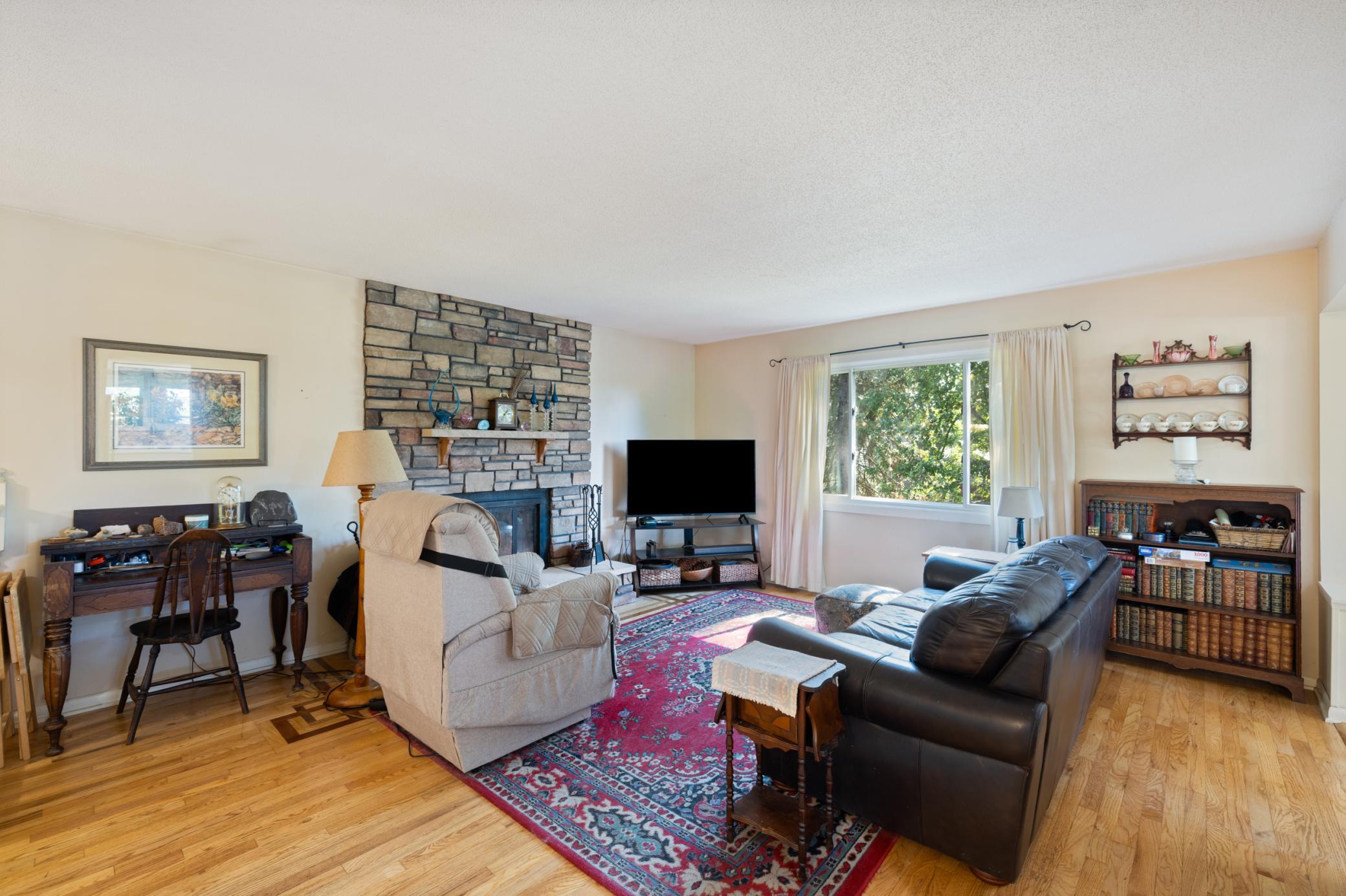 living room Offering Hardwood flooring and a beautiful inlaid design