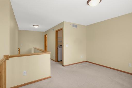 The laundry room is on the right and next to the loft.