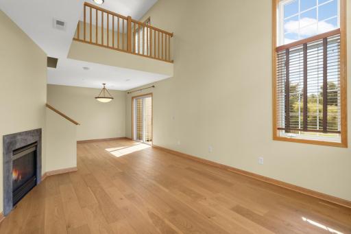 Photo for 349 Ojibway Path, Lino Lakes, MN 55014 - listing #7136189 Vaulted living room gives that open and airy feel, while the gas fireplace makes the space feel cozy in the cooler months.