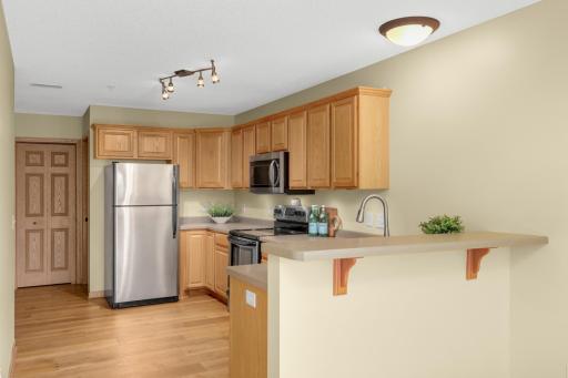 Freshly painted, stainless steel appliances, under cabinet lighting, pantry is straight ahead for additional storage. The breakfast bar is nice for additional seating/serving space.