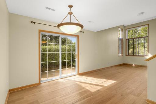 Informal dining room opens to living room and patio.