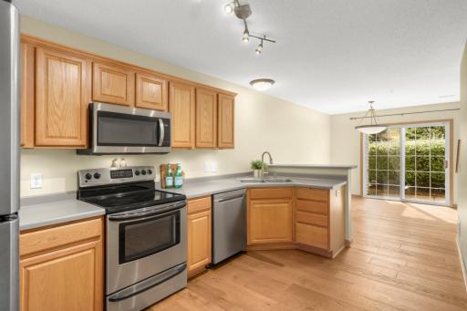 Stainless appliances and under cabinet lights highlight the space.