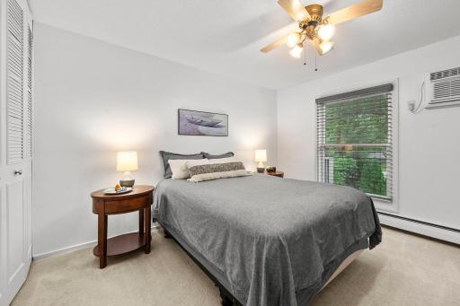 One of the 2 BRs with a large closet, overlooking the trees.