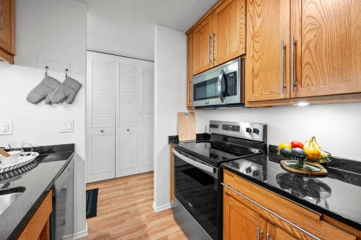 Kitchen features custom cabinetry and granite countertops.