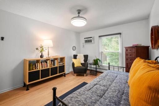 2nd BR overlooking the trees and featuring new flooring.