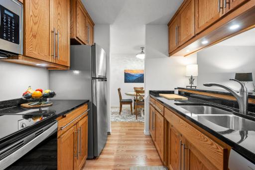 Kitchen features custom cabinetry and granite countertops.