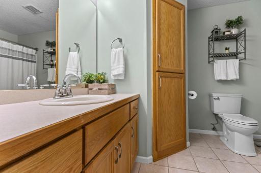 The upper level bathroom is generous in size and has plenty of storage!