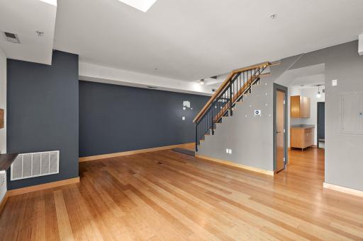 Living room w/ Open Staircase