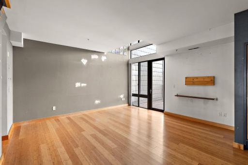 Living area opens to large, private deck. Painting credit provided