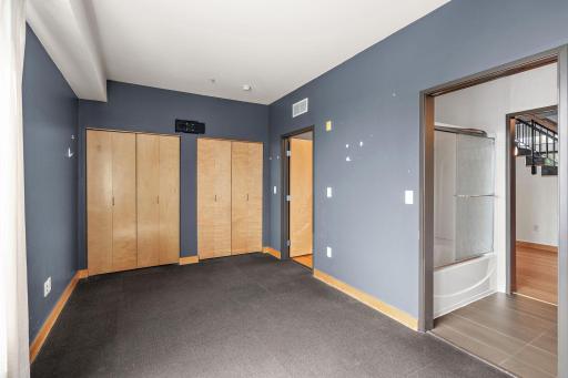 Primary bedroom. Painting credit will be provided