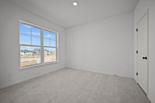 Private primary suite in the McBee plan offering comfort and separation. Images are from a similar home, interior selections may differ