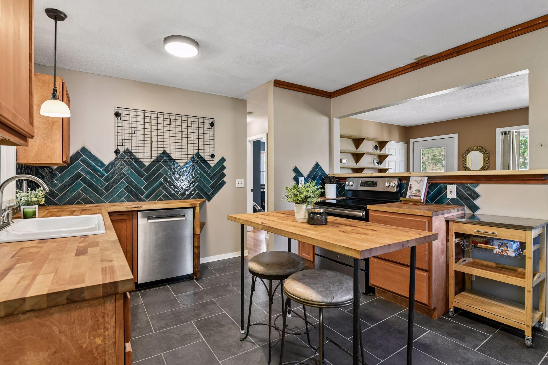 Kitchen with island seating and open shelving