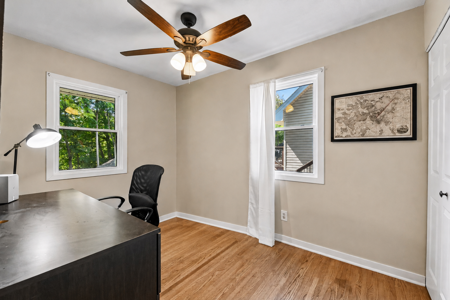 Bedroom with hardwood floor and ceiling fan