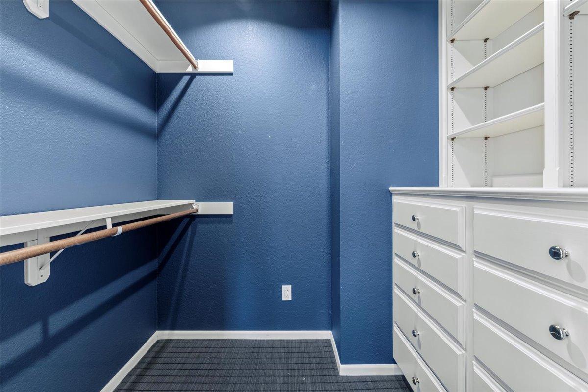 Spacious closet featuring built in cabinets in bedroom #3