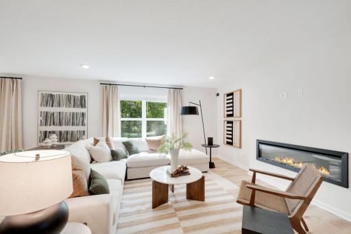 The family room is anchored around a low maintenance electric fireplace that keeps the room feeling very open. Bonus is that you can use the fireplace with or without heat! Outlet is already in place to hang a TV over the fireplace!