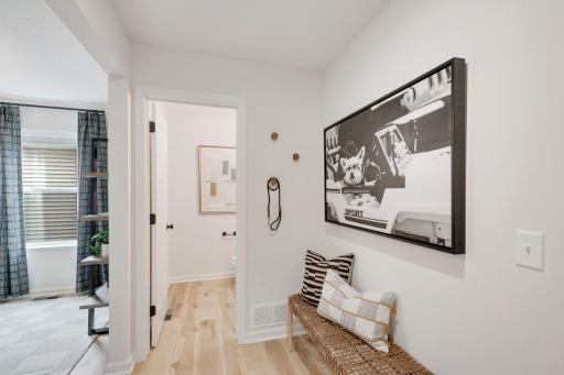 This area is off the garage: spacious mudroom with closet, powder bath, and an office space that's tucked away from the rest of the home!