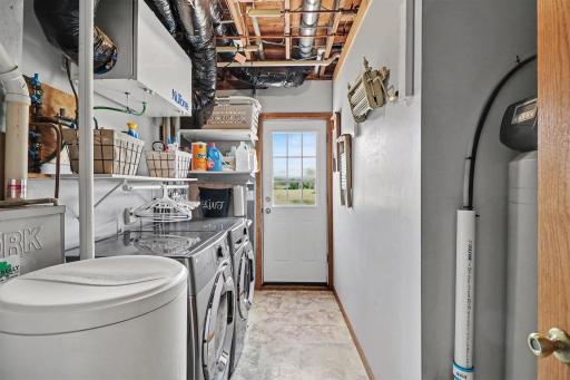 Utility room has walkout to the backyard.