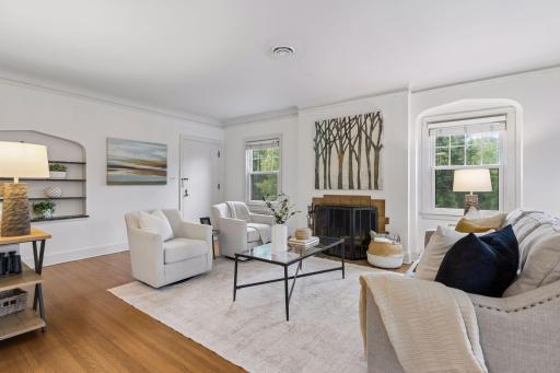 Upper level unit - Living room with woodburning fireplace.