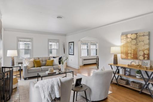 Upper unit - spacious living room with hardwood floors.