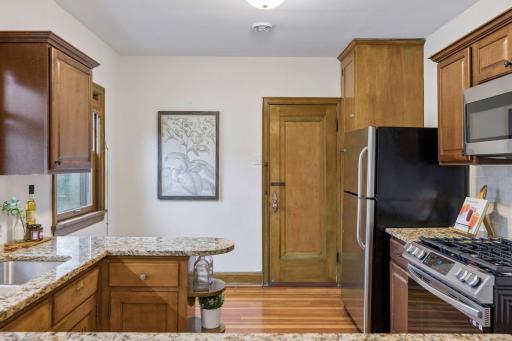 Upper unit - stainless refrigerator and gas range.