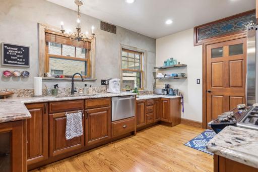 Main floor with custom cabinetry and granite counters.