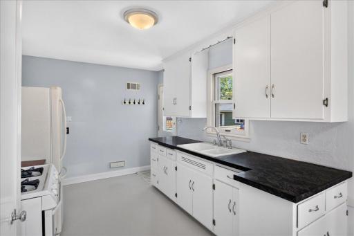 Freshly painted kitchen cabinets, gas range, and more!
