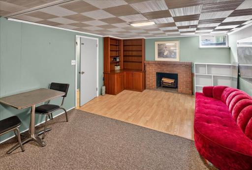 Huge lower level rec room with wood burning fireplace and tons of unfinished space to add a future bathroom and/or bedroom.