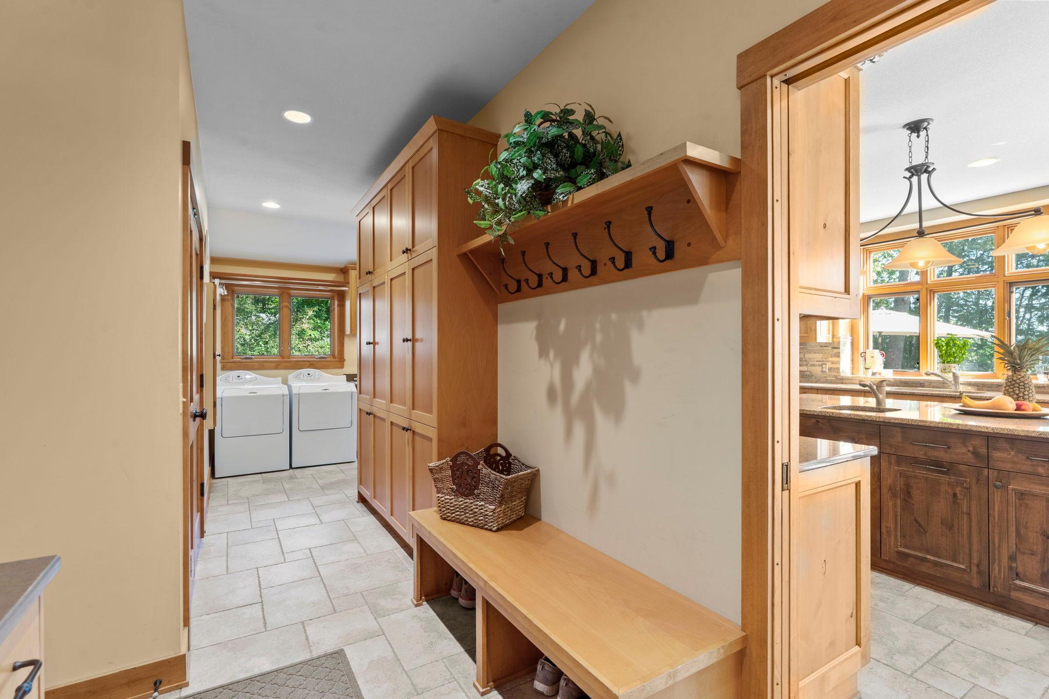 Large mudroom with door to river