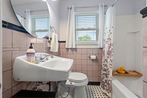 Main floor bath with shower and bathtub.